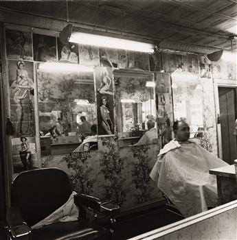 DIANE ARBUS (1923-1971) Pin-Up Collection at a Barber Shop. 1963; printed 1980 by Neil Selkirk.                                                  